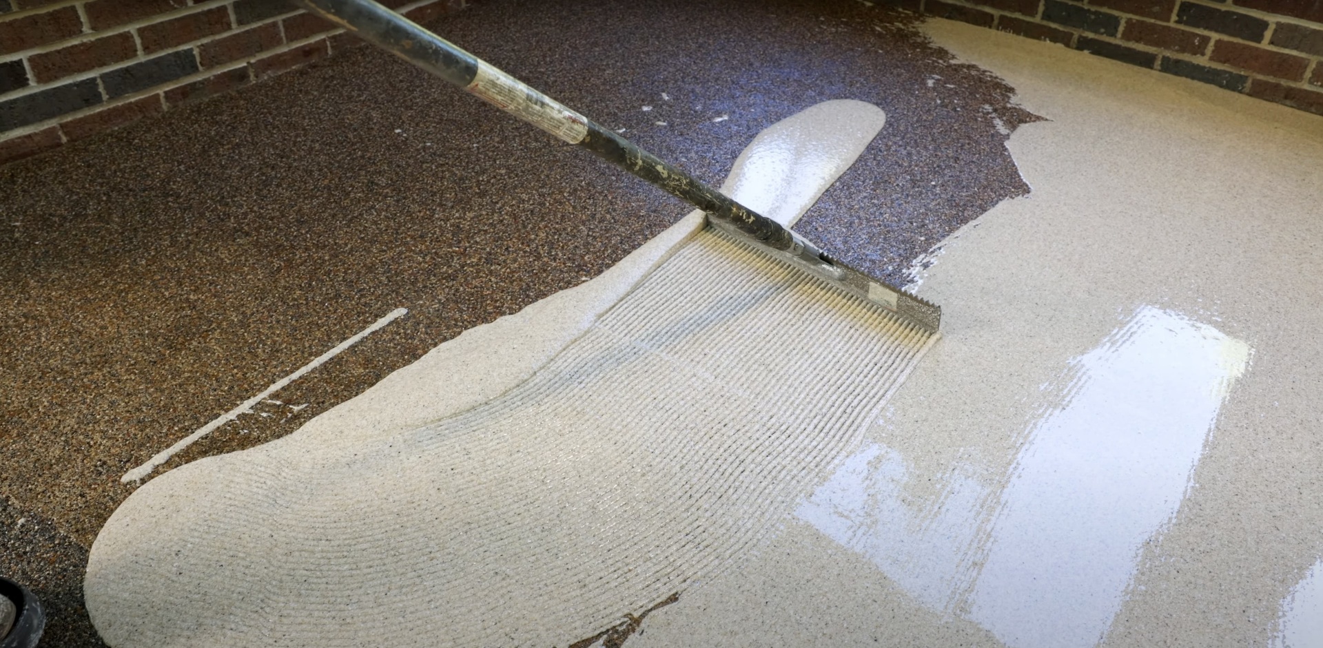 Fresh concrete being finished with professional tools and techniques