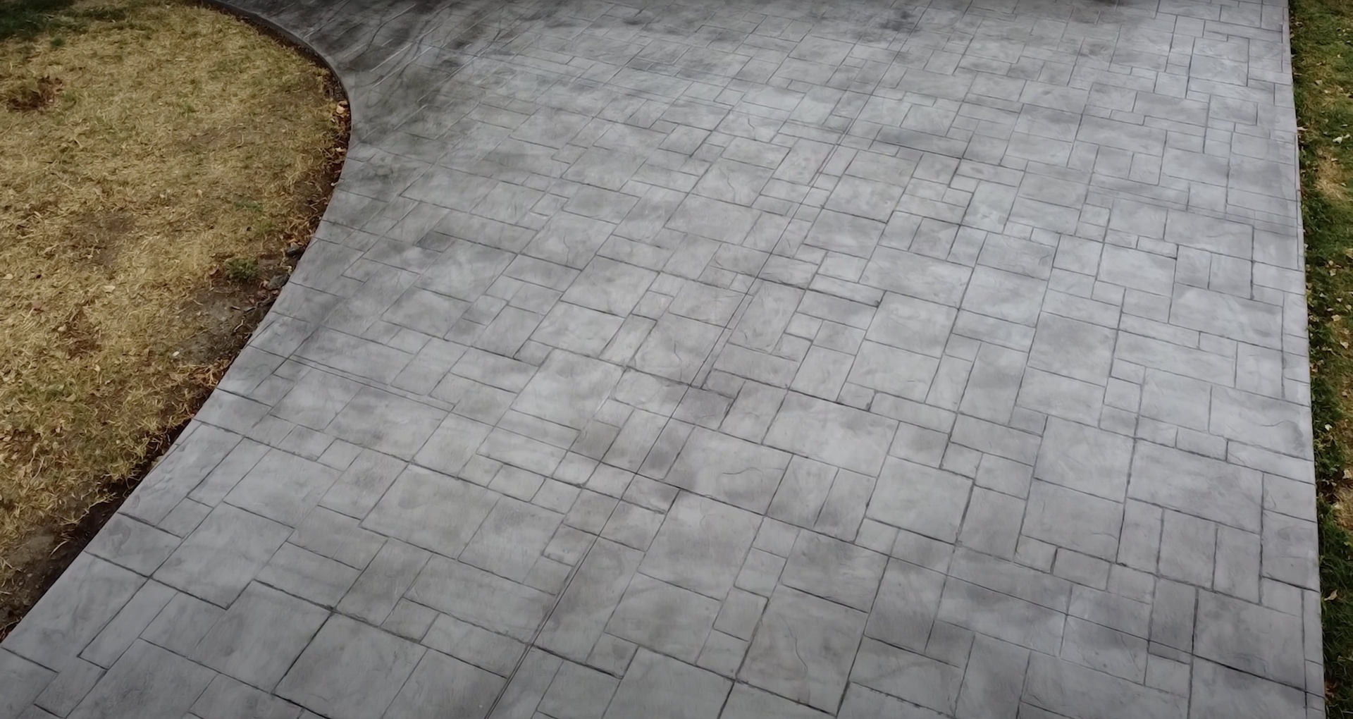 Close-up view of stamped concrete patio showing detailed texture and pattern work